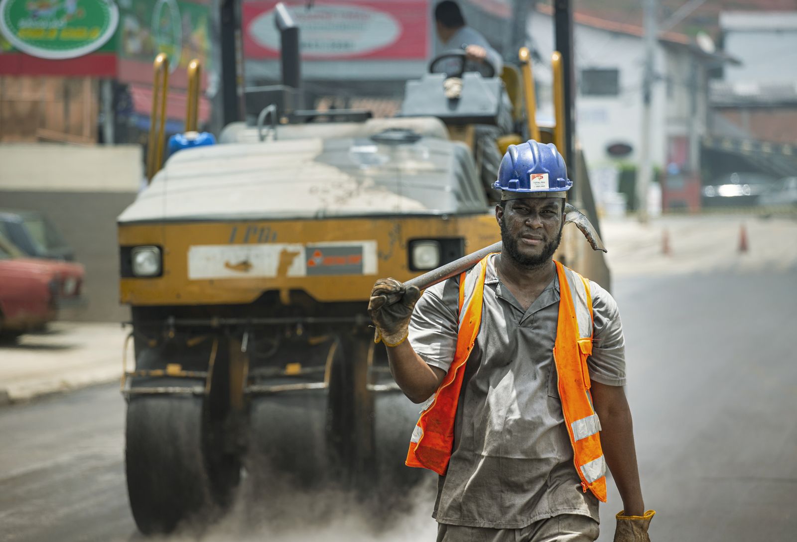 Men working on asphalt road construction